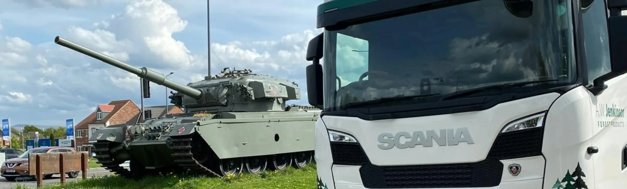 A.W. Jenkinson Scania wagon parked next to tank on cloudy spring day