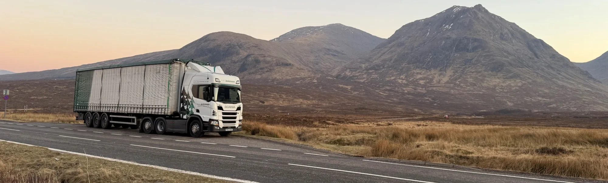 A.W. Jenkinson truck parked on the A82 near Glencoe featuring an amazing sky.